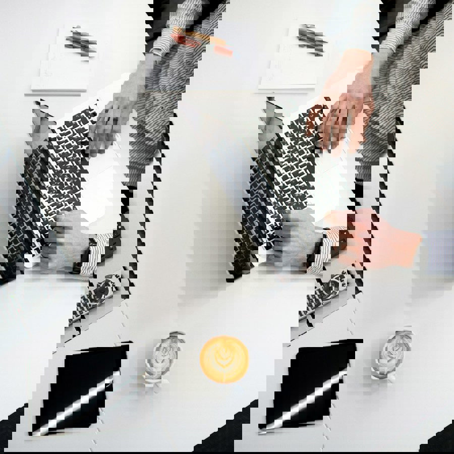 Person Using Laptop On White Wooden Table 1E1db071dca7dd4b3b9aec68d8ed3aad