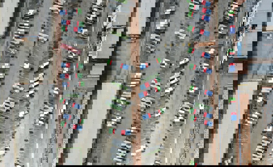 An Aerial View Of A Parking Lot Filled With Cars 85Bdef55b699775f8264126695e66a36