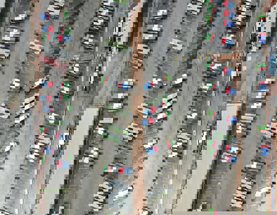An Aerial View Of A Parking Lot Filled With Cars 85Bdef55b699775f8264126695e66a36