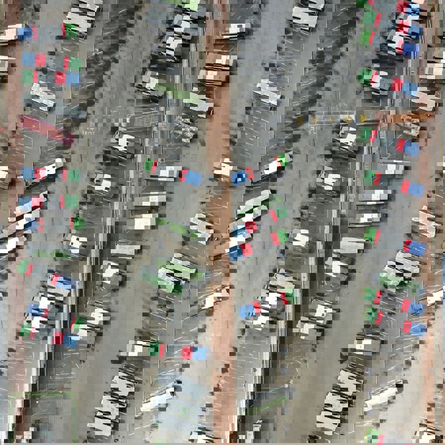 An Aerial View Of A Parking Lot Filled With Cars 85Bdef55b699775f8264126695e66a36